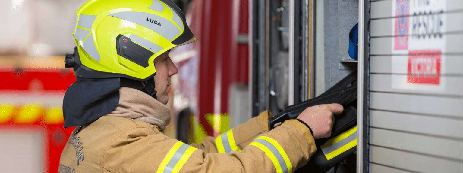 A firefighter checking a truck