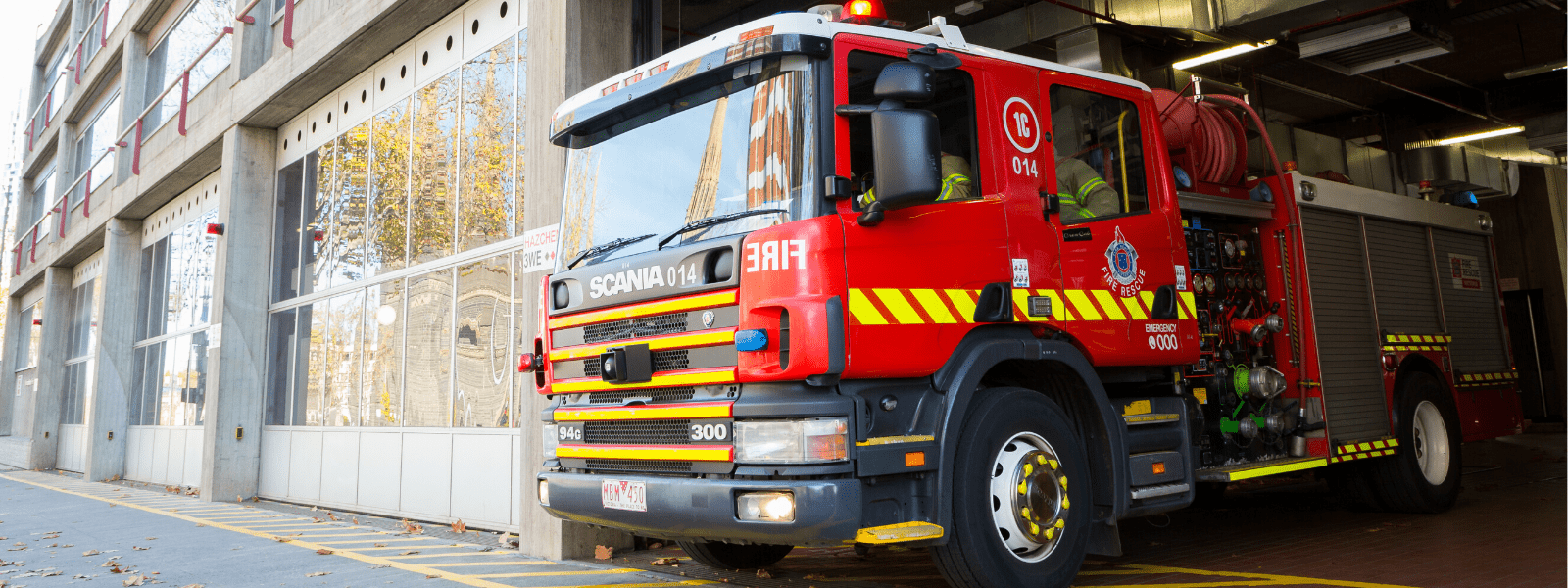 A fire truck leaving the station 