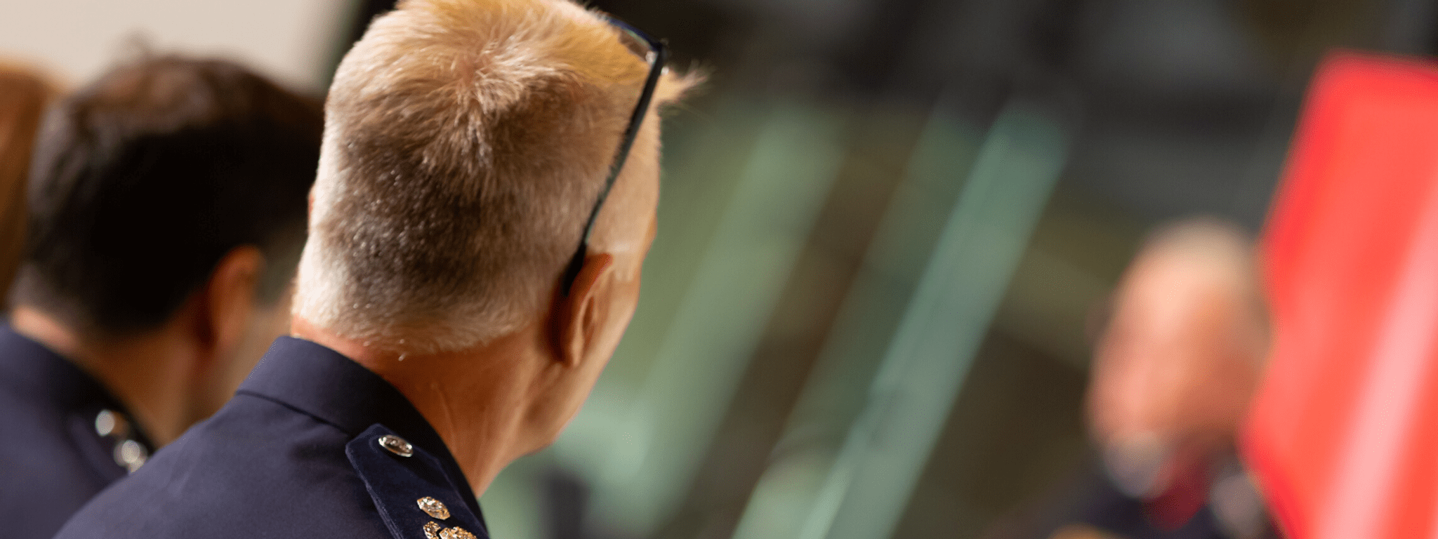 People listening at a meeting