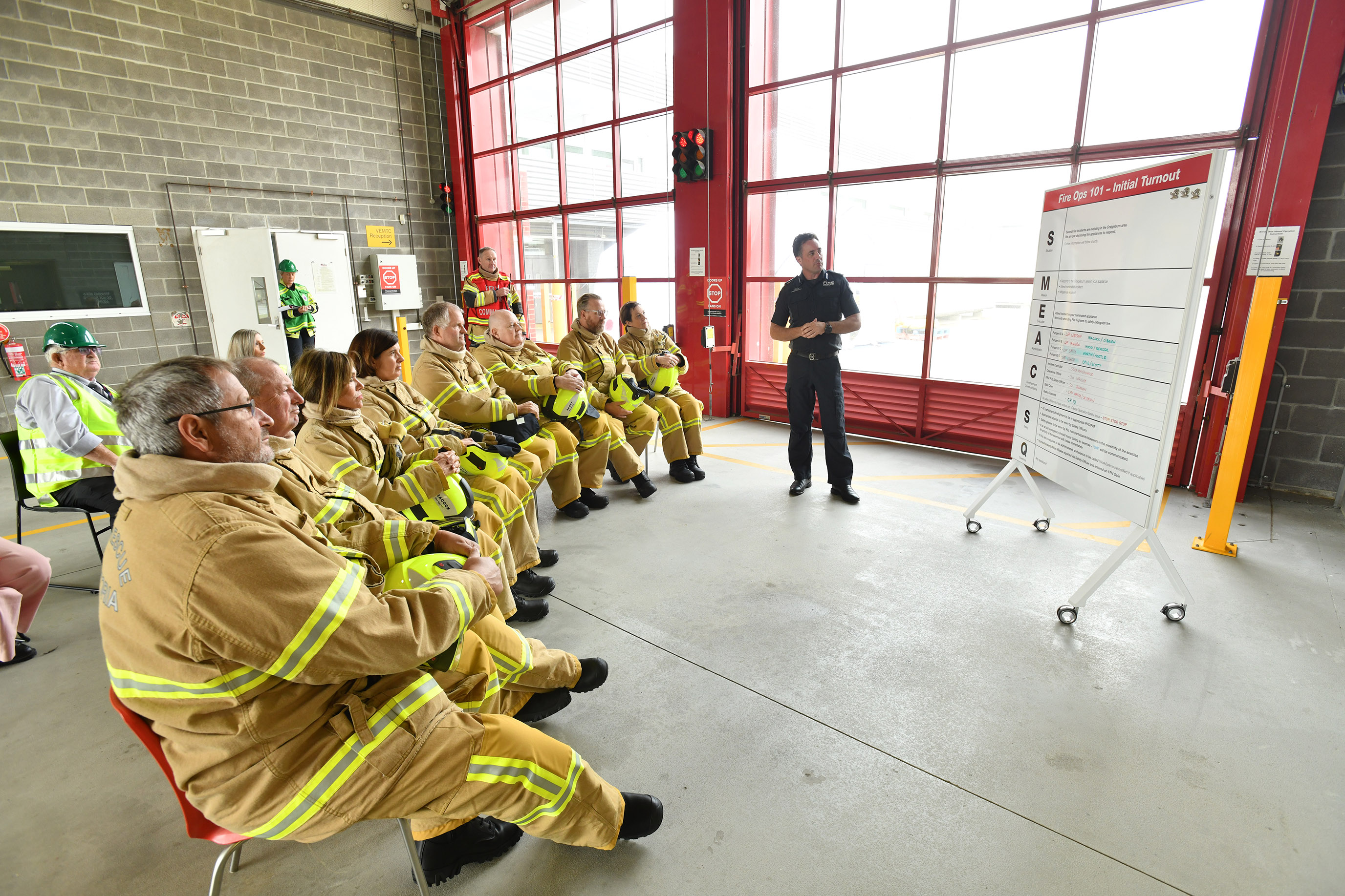 Participants are given a crash course in firefighting before getting on the tools